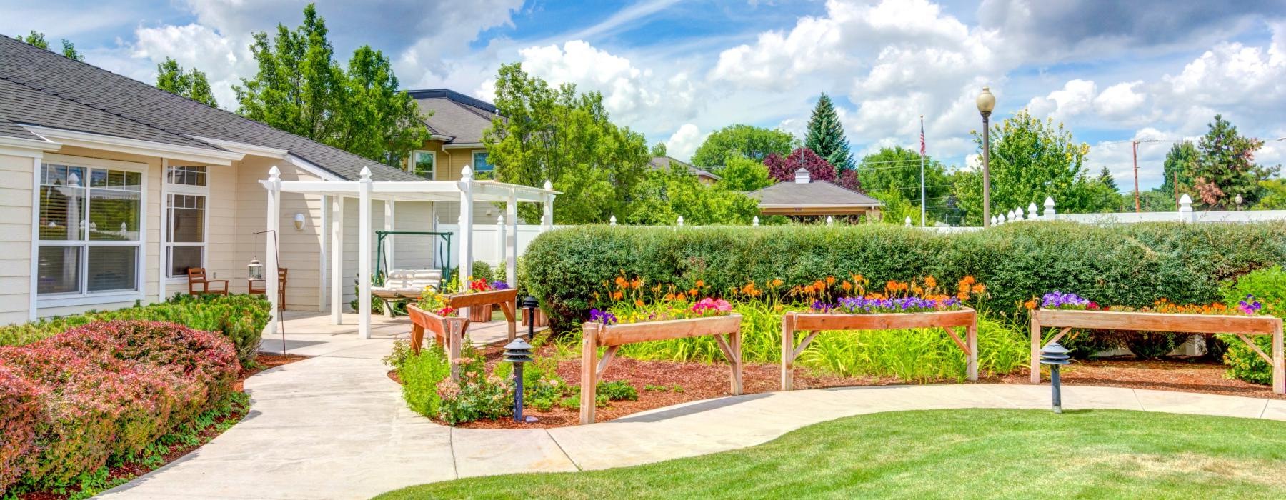 a backyard with a bench and a house