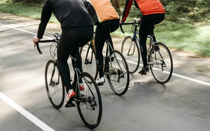 a group of people riding bikes